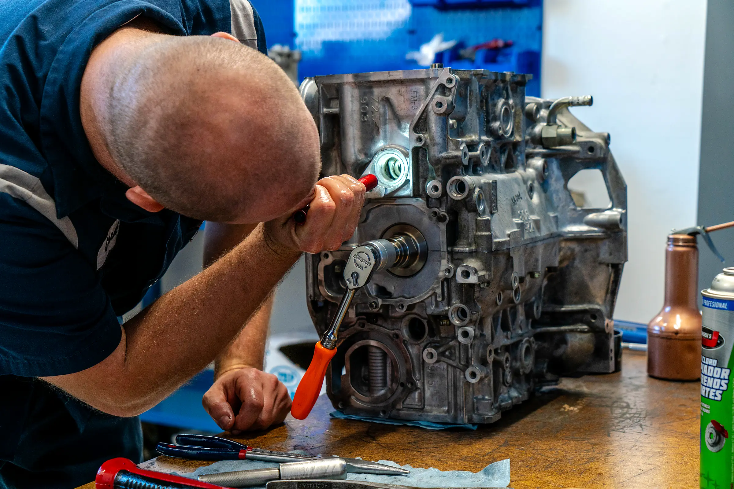 Tech torquing a bolt on an engine block