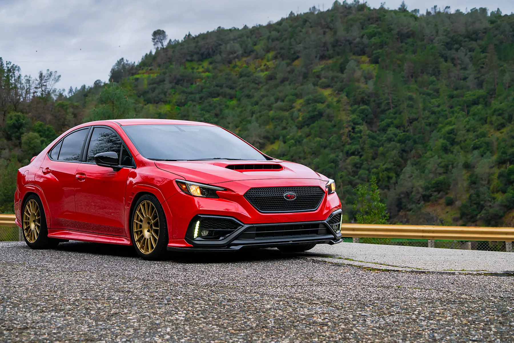 Wide: red WRX on a mountain pullout